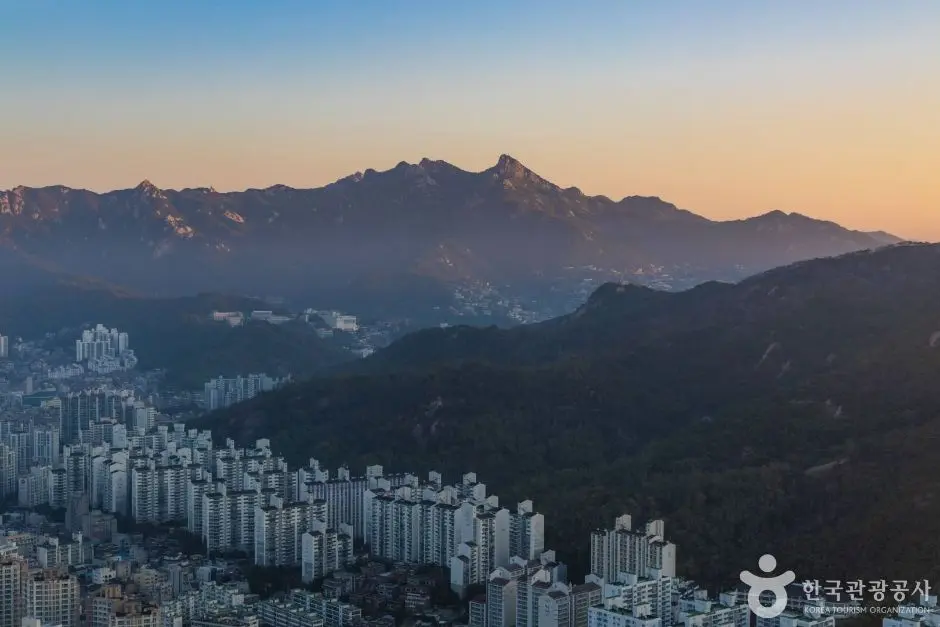 Seoul cityscape and mountains at dawn from Ansan hiking trail viewpoint
