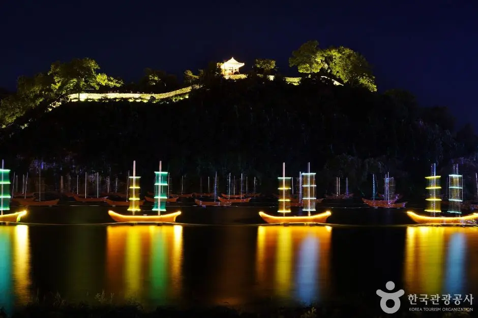 Baekje Cultural Festival illuminated riverside structures at night