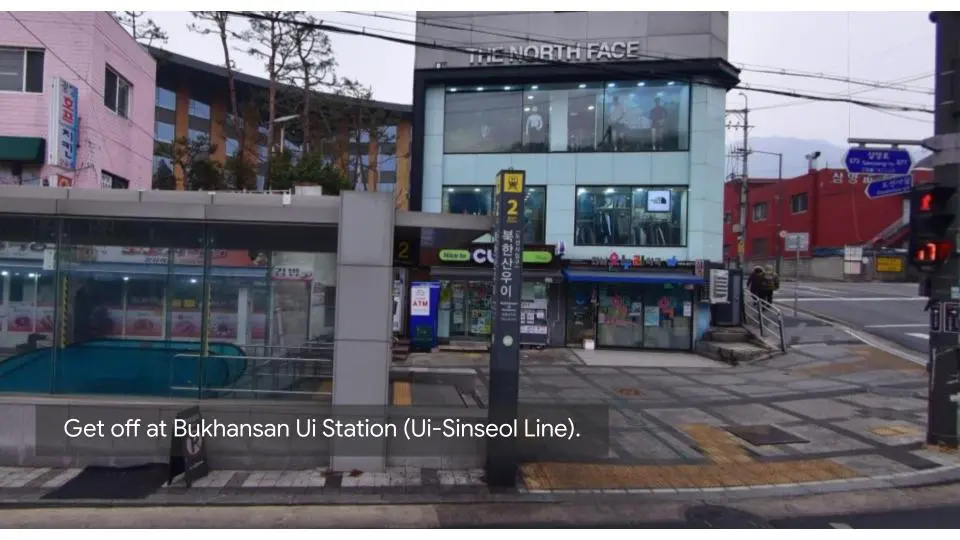 Bukhansan UI Station entrance with street view and directional signage