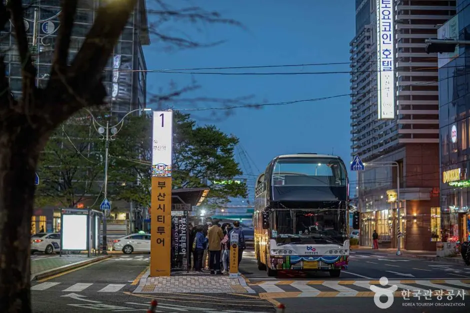 Busan city tour double-decker bus stopped at downtown street station