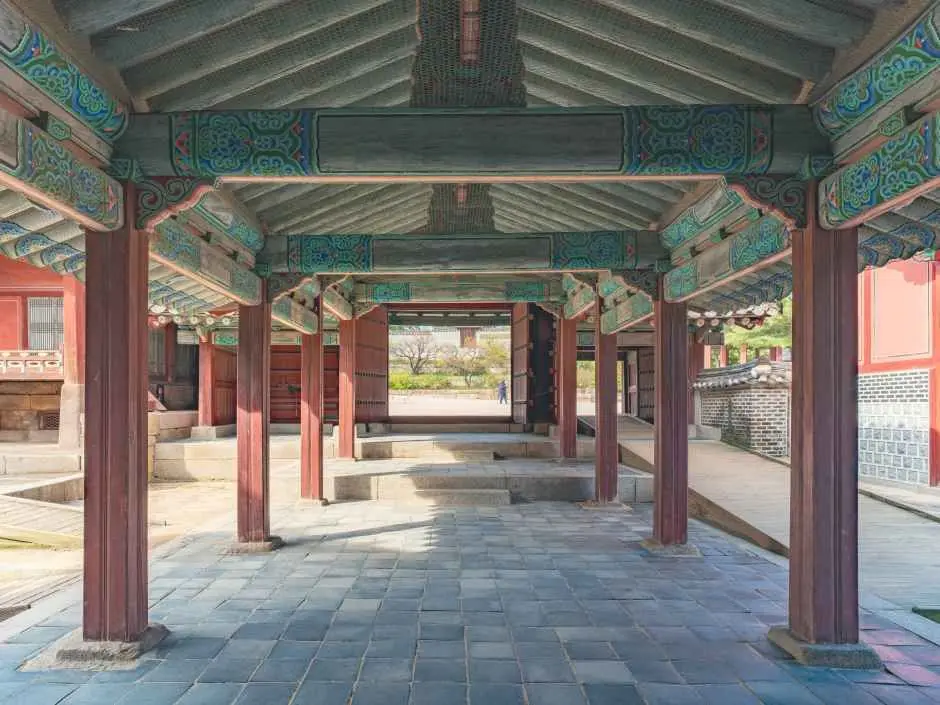 Traditional wooden corridor at Changgyeonggung Palace with decorative turquoise beams