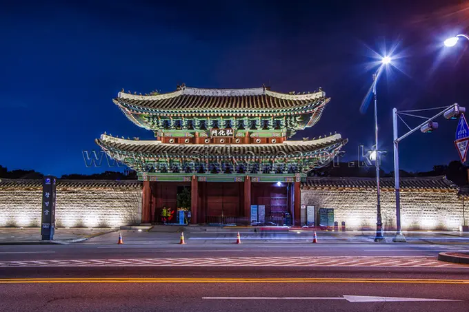 Changgyeonggung Palace illuminated gate structure at night in Seoul