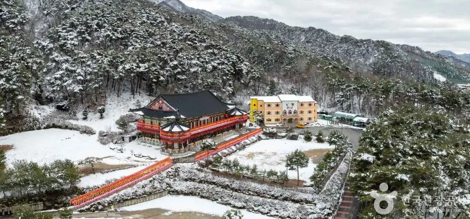 Chiaksan National Park in winter snow with red temple building and yellow monastery