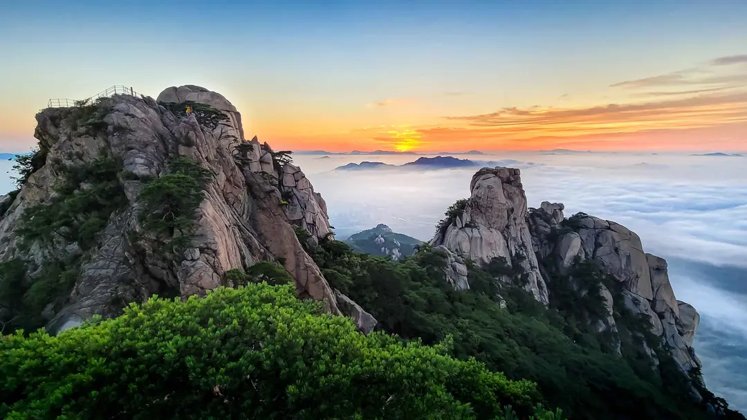 Dobongsan rocky peaks sunrise above clouds valley