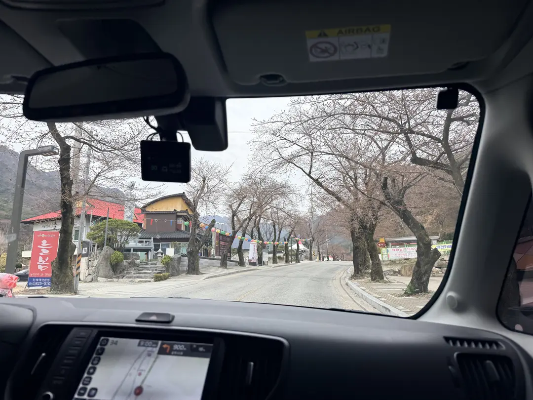View from car dashboard approaching Gyeryongsan Mountain trailhead area