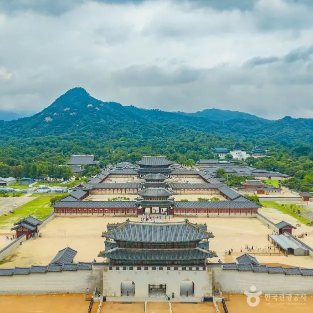 Aerial view of Gyeongbokgung Palace with mountain backdrop