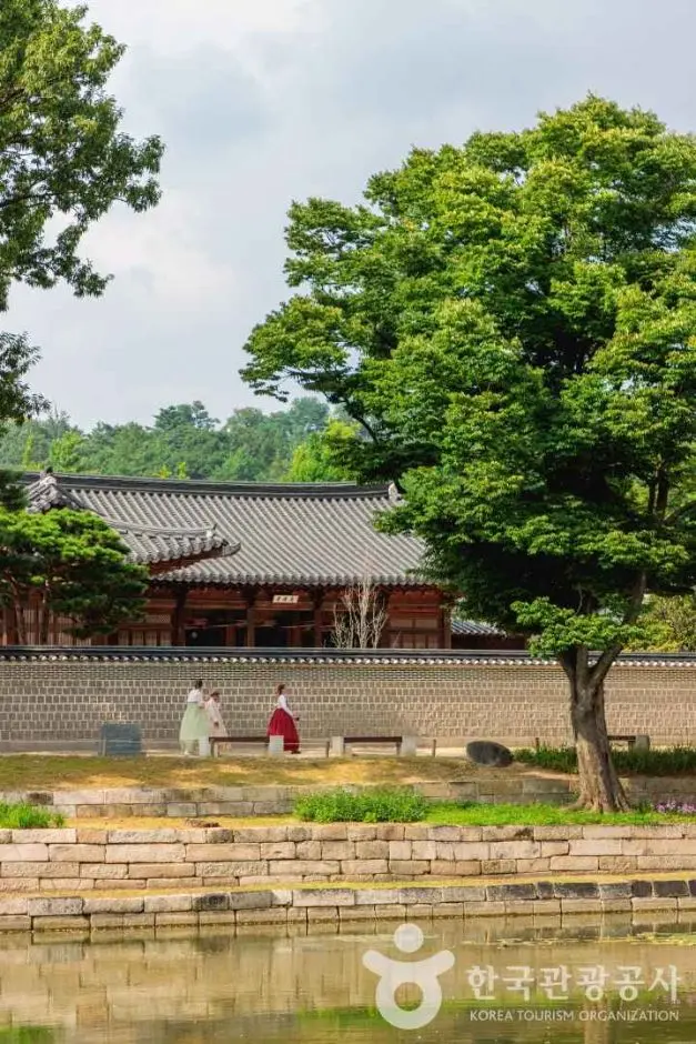 Gyeongbokgung Palace traditional architecture with courtyard and tree