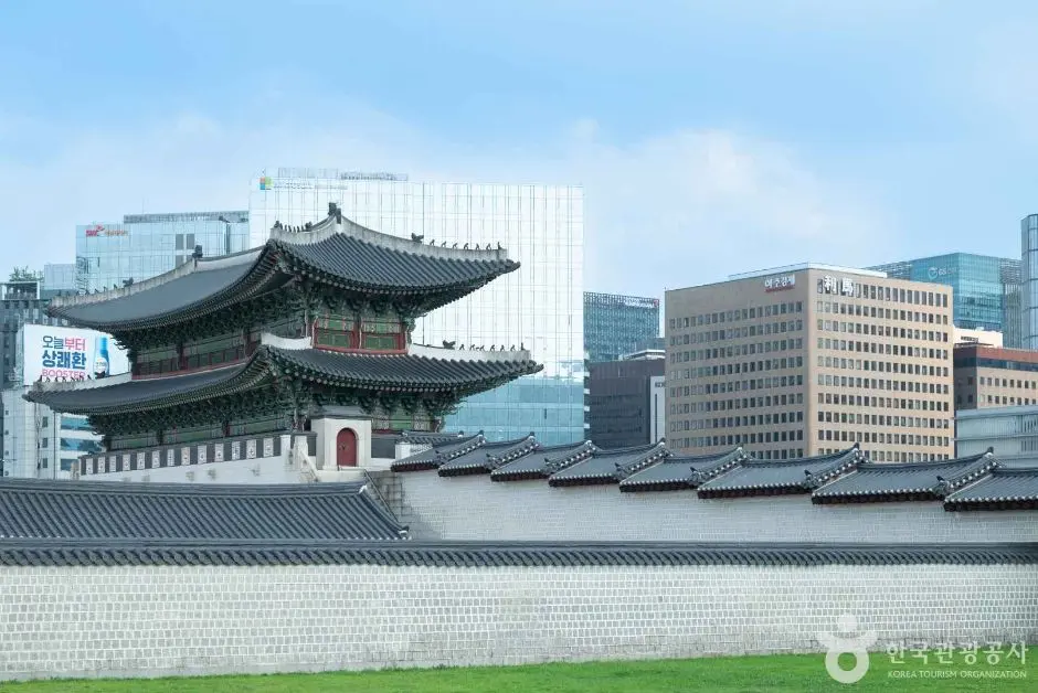 Gyeongbokgung Palace traditional architecture with Seoul city skyline