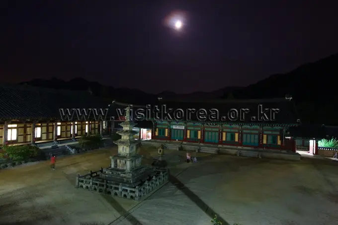 Haeinsa Temple illuminated at night under full moon in Gayasan