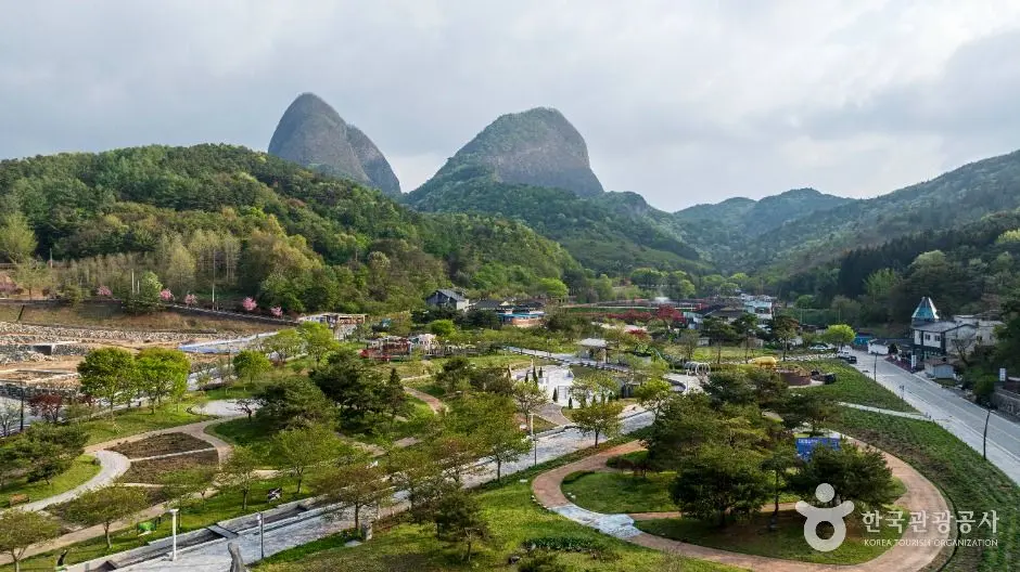 Maisan Mountain twin peaks with valley village and winding river