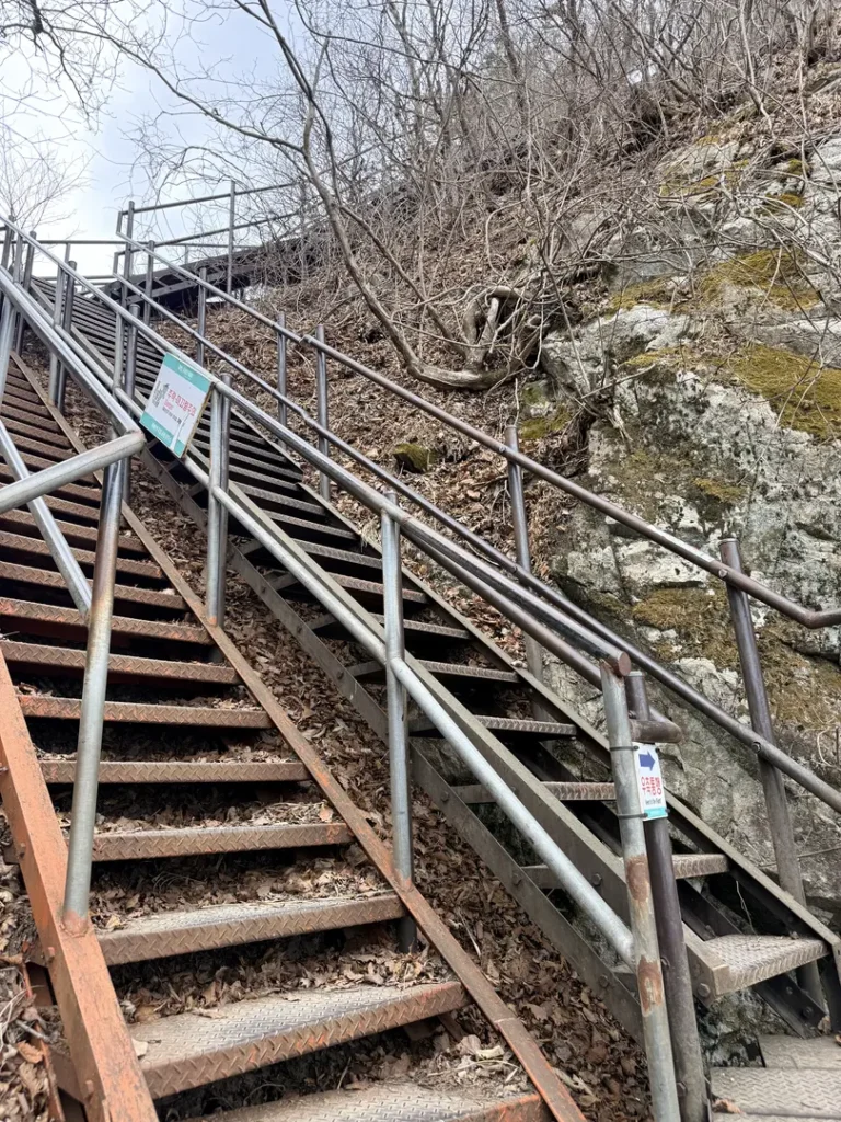 Metal staircase with railings on Gyeryongsan Mountain hiking trail