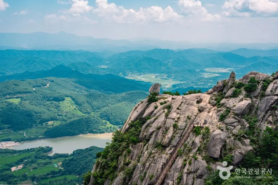 Mosanjae ridge overlook with vast mountain valleys and lake below
