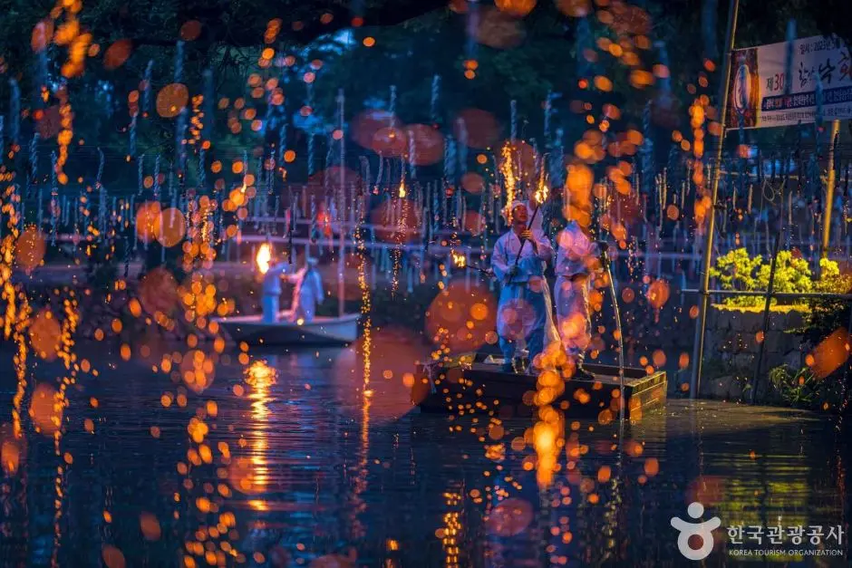 Nakhwa Nori fire rain falling over water at night festival