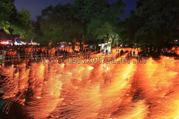 Falling fire rain sparks during Nakhwa Nori festival at night