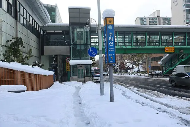 Surisan Station entrance covered in snow during winter