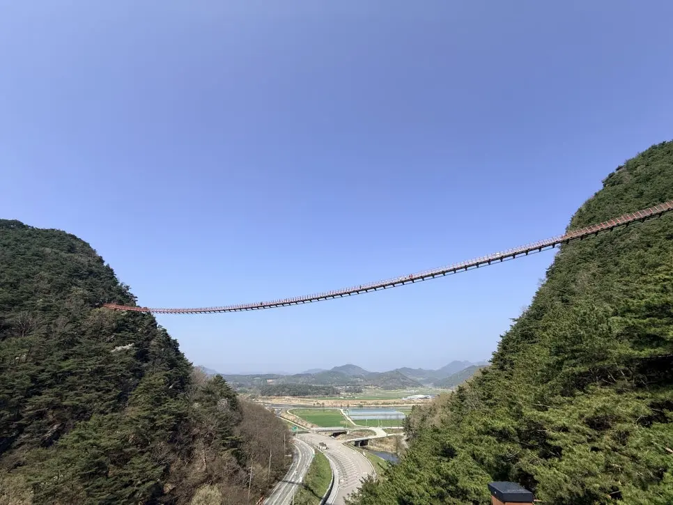 Chaegyesan suspension bridge spanning between two forested peaks with valley below