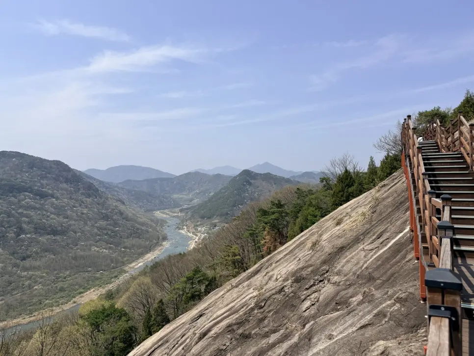 Panoramic view of Seomjingang River valley from Yonggwolsan Sky Trail with wooden stairs