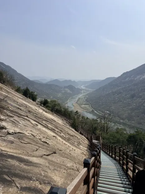 Panoramic Seomjingang River valley view from Yonggwolsan Sky Trail boardwalk